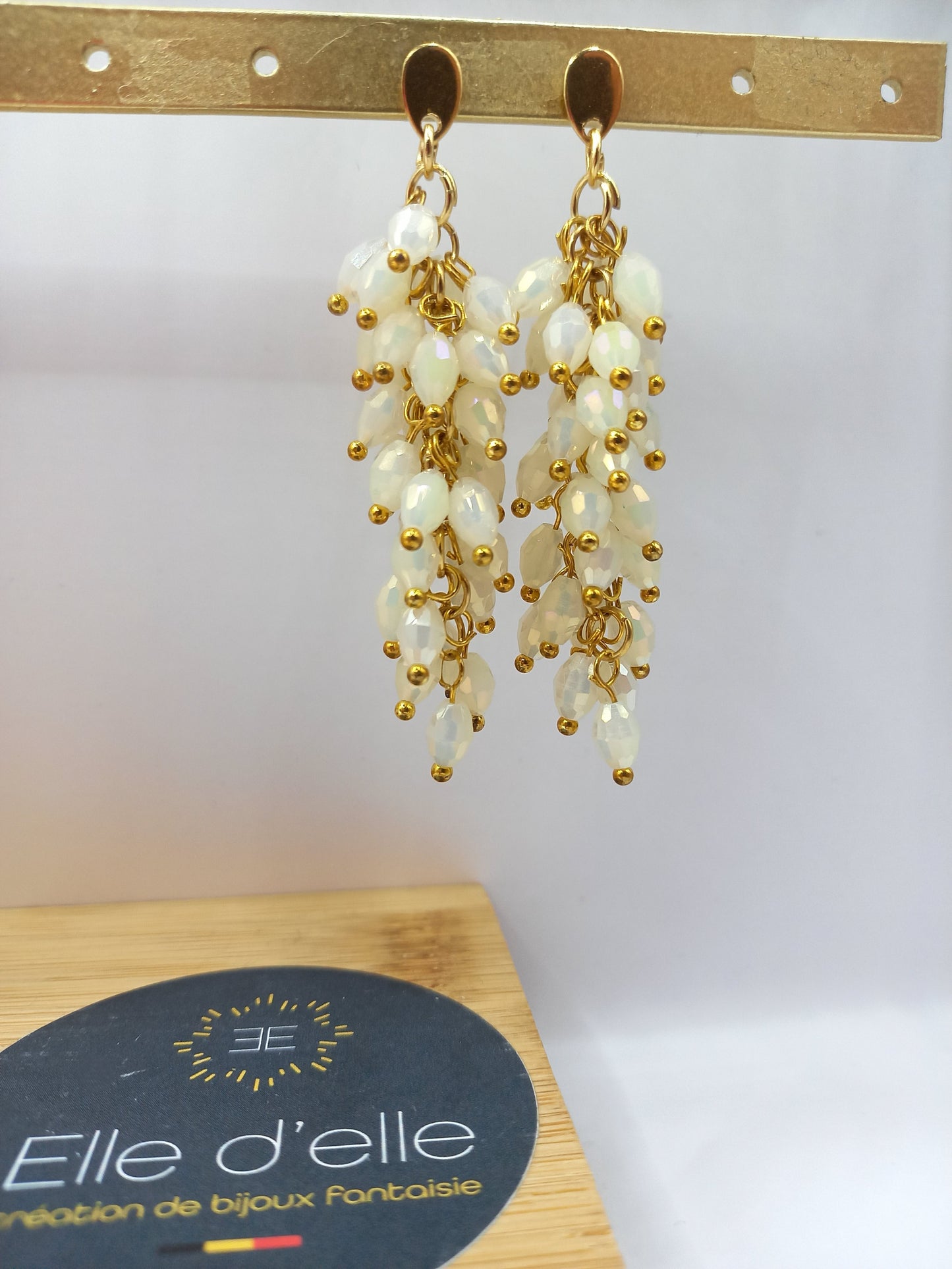 Boucle d'oreille - grappe pierres blanches