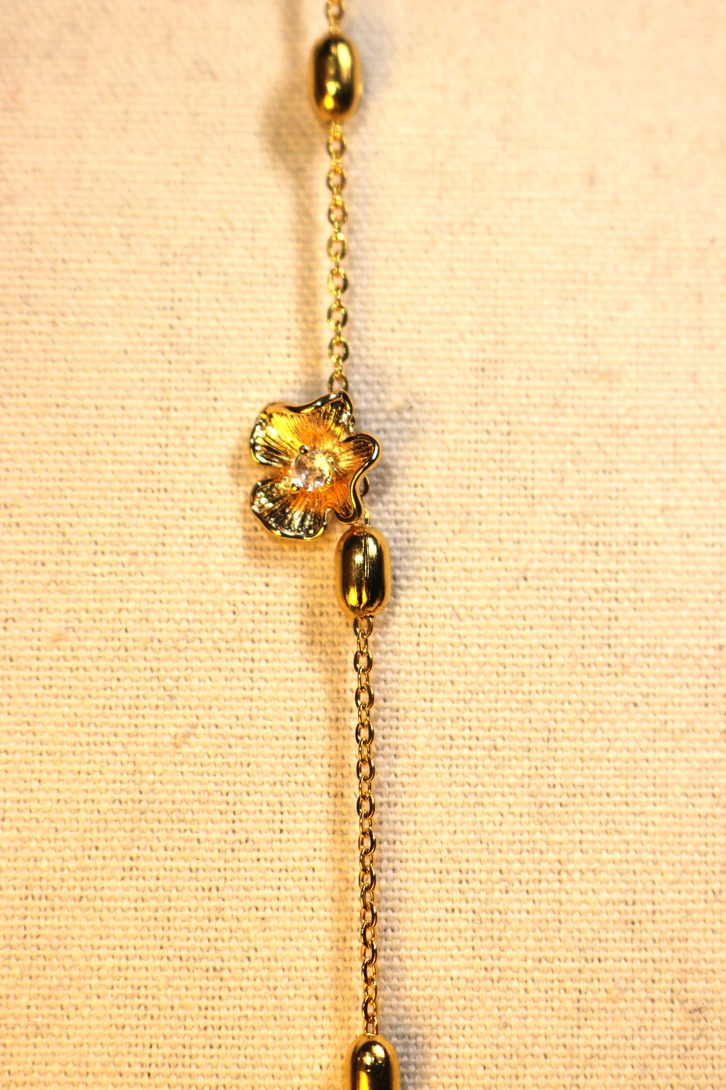 Bracelet - chaîne boule ovale dorée fleur